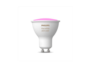 Philips Hue spotlight bulb emitting a pink light
