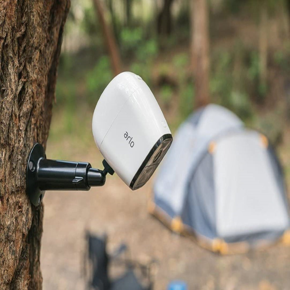 A Camera mounted on a tree at a camping site