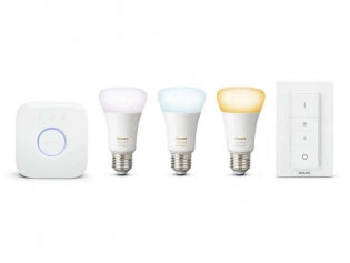 a philips hue hub on the left with 3 light bulbs in the centre showing different shades of white light and a Philips hue dimmer switch on the right