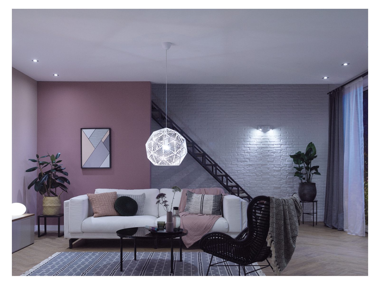 A living room with furniture and bright white lighting 