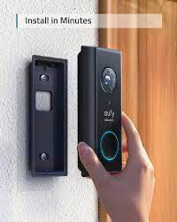 the eufy smart video doorbell being installed in its wall attachment