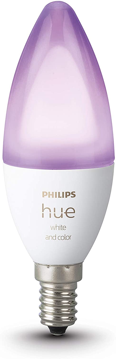 a philips hue e14 candle shaped colour smart light bulb showing a purple light effect