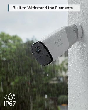 a eufycam2 smart security camera mounted to a wall with rain falling on it.  caption reads, built to withstand the elements, IP67 logo