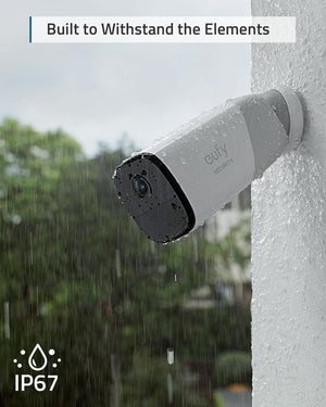 a eufycam 2 pro smart security camera attached to a wall with rain falling and the IP67 logo.  the caption reads, built to withstand the elements