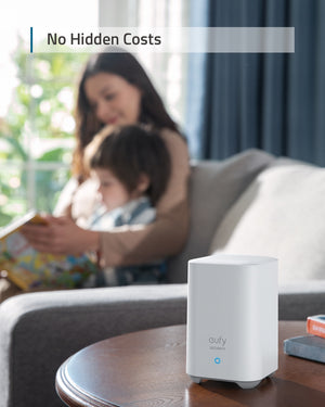 a women and child in the background.  in the foreground, a eufy homebase 2.  Caption reads, no hidden costs.