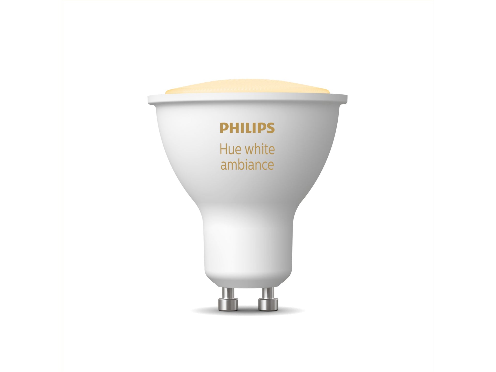 a philips hue smart gu10 lightbulb with the light on