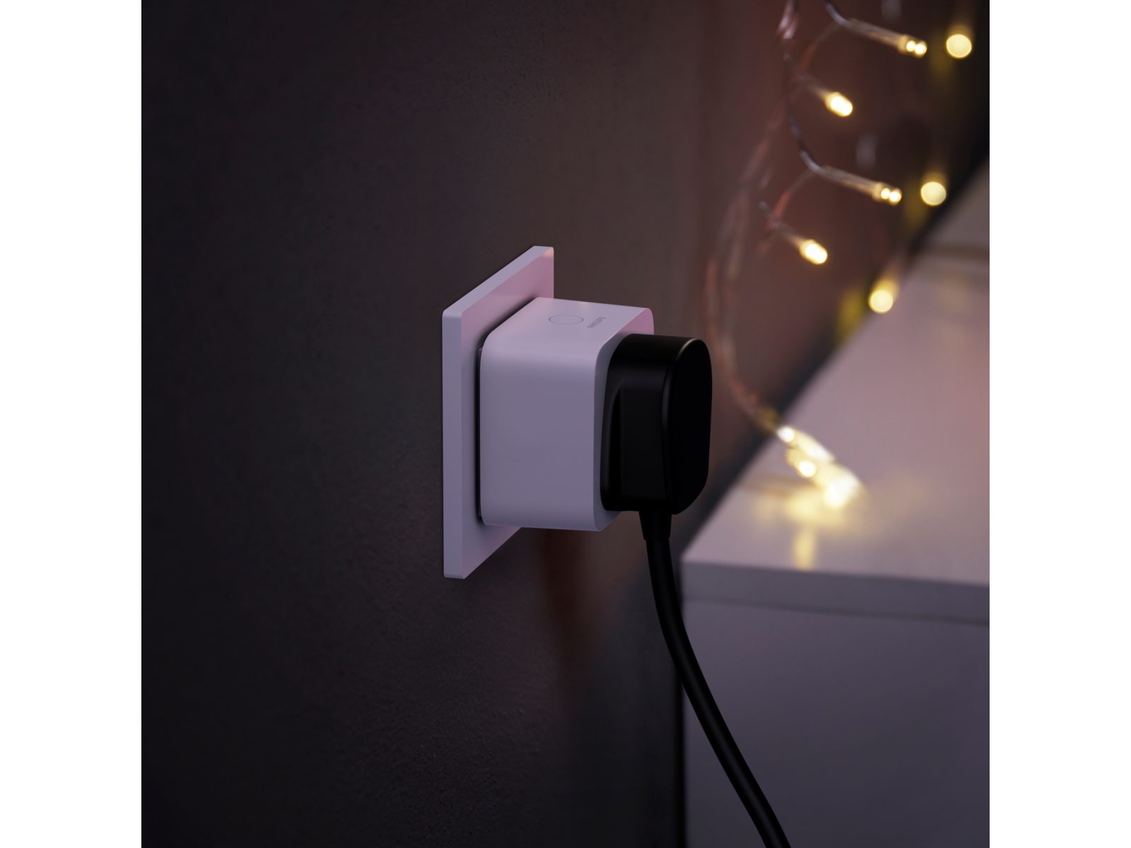 a smart power plug with an appliance plugged in