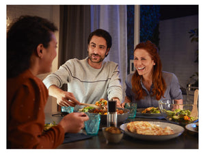 3 people sitting at a dining table