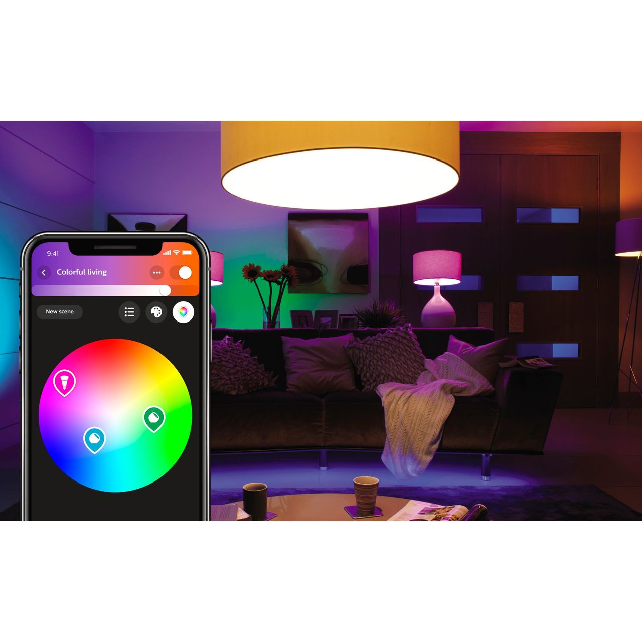 A room with pink, blue, purple, green and white lighting and a mobile phone showing the philips hue app being used to choose the lights' colours